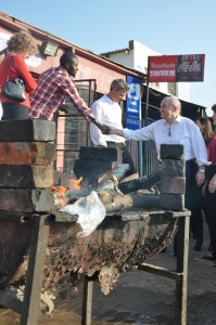 IU President Michael McRobbie greets a local resident of the Diepsloot township.
