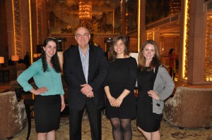 IU President Michael McRobbie poses for a picture with IU students Grace Jaroscak, Kelly McCarthy and Eleanor Wannemuehler. All three are studying in China this year.