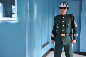 A member of the security force guards the door to North Korea at the Joint Security Area.