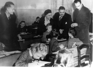 As cultural adviser to American occupation forces in Germany at the end of World War II, Herman B Wells (standing, second from right) worked with students in a German classroom. The picture was taken in 1948.