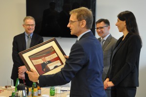 Polish-American Freedom Foundation President and CEO Jerzy Kozminski receives a framed picture of when former Polish president Lech Walesa visited IU. 
