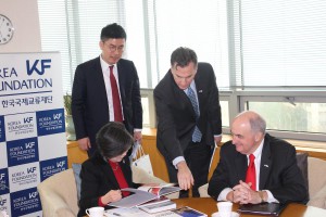 IU President Michael McRobbie, far right, with Klum-Jin Soon, executive vice president of the Korea Foundation, seated left. Pointing is IU School of Global and International Studies Dean Lee Feinstein. 