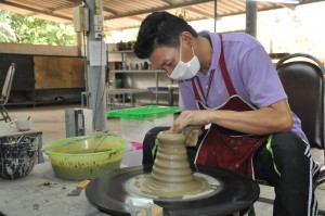An employee in Doi Tung's ceramics factory. 