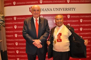 IU President Michael McRobbie with Disnadda Diskul, who proudly displays his new honor from IU along with his old IU letterman sweater from his tenure of Coach Jerry Yeagley's first soccer team captain. 