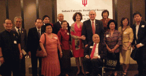 The Pienchob family and others pose with President McRobbie and wife Laurie